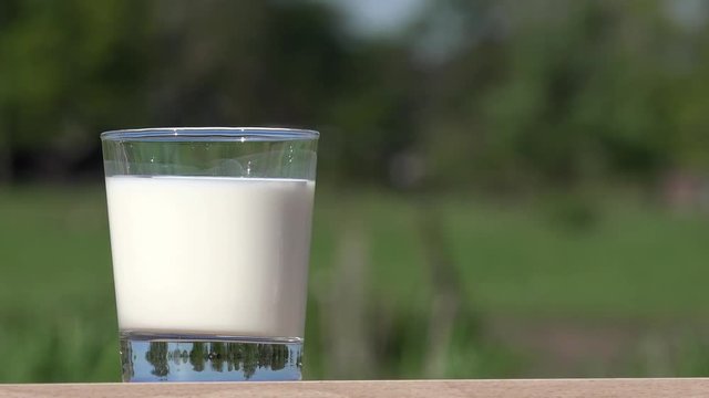 milk glass standing on table