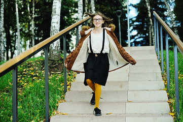 Kid girl in autumn park