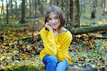 Kid girl in autumn park