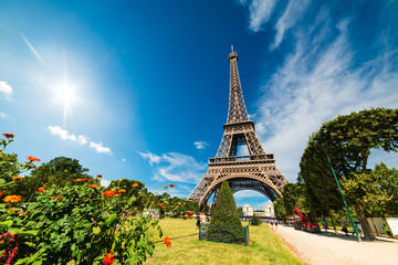 Sun shining over world famous Eiffel tower in Paris