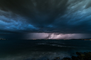Fototapeta na wymiar Storm and thunder over Lake Balaton dark clouds over sea wide angle nature photo