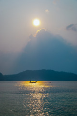 Naklejka na ściany i meble Fishing boat in a sunset, Koh Pha Ngan