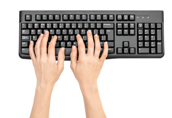 Woman's hands typing on computer keyboard on white background.