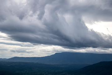 Beautiful blue sky with clouds and mountains.