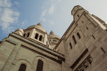 Fototapeta premium The amazing facade of the basilica Sacre-Coeur. View from below. Symbol of the Montmartre district. Paris, France