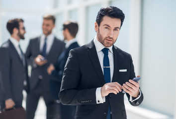 businessman looking at the smartphone screen