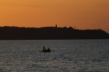 fishing at sunset