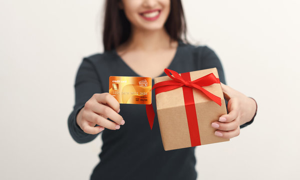 Beautiful Woman Holding Credit Card And Gift Box