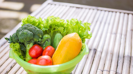 Healthy Food. There are vegetables, cucumbers, tomatoes and broccoli in the sieve for cleaning.