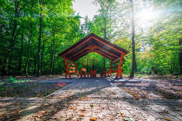 wooden cottage alcove in mountain forest nature summer green landscape