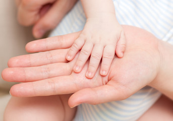 Fototapeta na wymiar hands - baby and parents