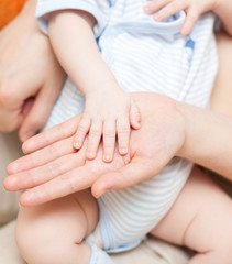 Fototapeta na wymiar hands - baby and parents