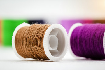 The roll of thread on background,show texture of brown color thread,needlework,craft,sewing and...