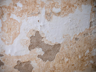 Moistured damaged wall falling apart.