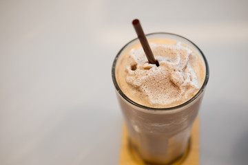 Close up glass of chocolate milkshake