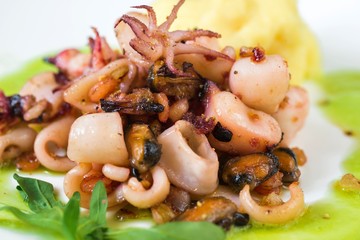 Seafood mix, potato and sauce.