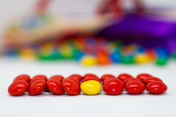 colorful chocolate buttons on a white background