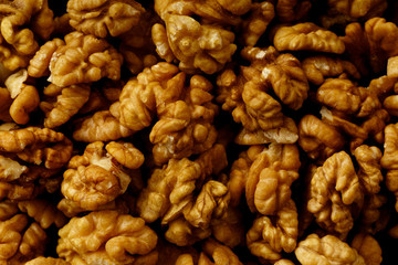 Close up picture of raw walnuts with no shells. Overhead view