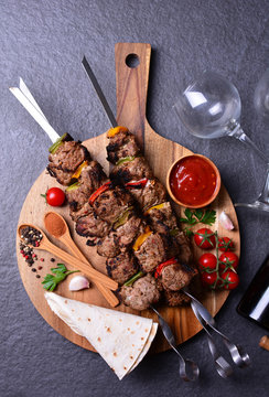 Wine and kebab with spices and vegetables