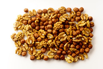 Overhead image of assorted nuts on white background