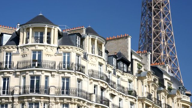 Building roofs and balconies of Paris and the Eiffel Tower