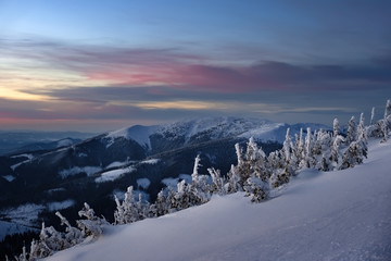 Fototapeta na wymiar Winter landscape of a mountain range and valley in winter.