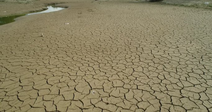 Aerial view of Dry cracked earth. Climate change and drought land. Global warming