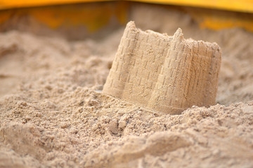 Fototapeta na wymiar sand castle in the sandbox