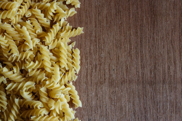 Uncooked fusilli pasta background