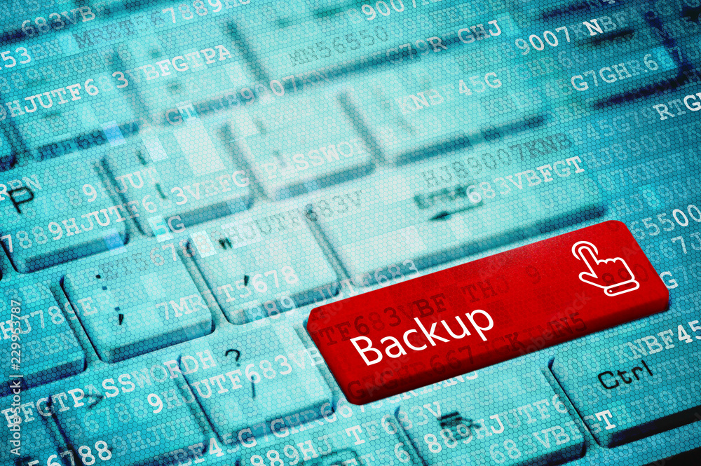 Wall mural red key with text backup and touch finger icon on blue digital laptop keyboard