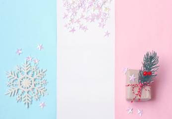 Christmas, New year background, pastel color paper, gift box and snowflake, confetti stars