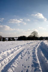 winter landscape with road and blue sky