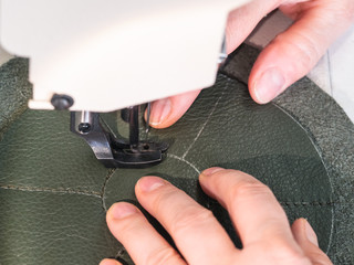 craftsman stitches the bottom on sewing machine