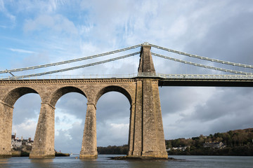 A view of the historic Menai suspension bridge spanning the Menai Straits, Gwynnedd, Wales, UK.