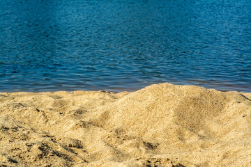 Rustic sandy beach by the river
