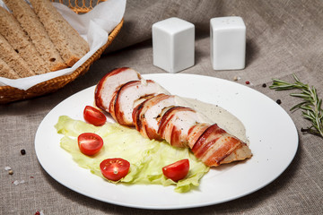 chicken breast with pear, cheese, bacon and mushrooms with cream sauce. concept healthy food.