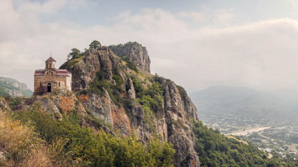 Fototapeta na wymiar Mountain landscape, Shoininski Church in rocky terrain. panorama. sunny day