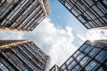 Naklejka premium Apartment houses with cloudy sky