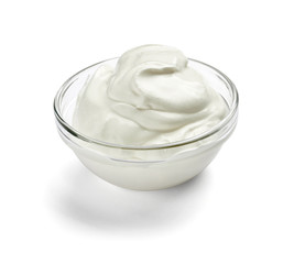 close up of a white beauty cream or yoghurt on white background