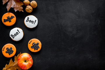 Halloween composition with autumn harvest and cute round hallooween badges with rats, ghousts, Boo text on black background top view copy space