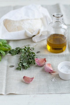 Fresh oragano and garlic with pizza dough