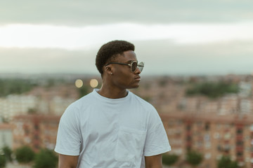 Young fashion men with urban background