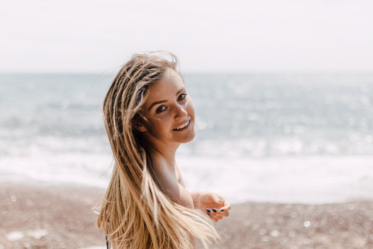 Portrait of a beautiful blonde woman on the beach