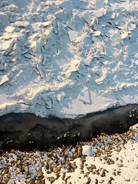 Ice floating over the frozen Danube river during cold winter