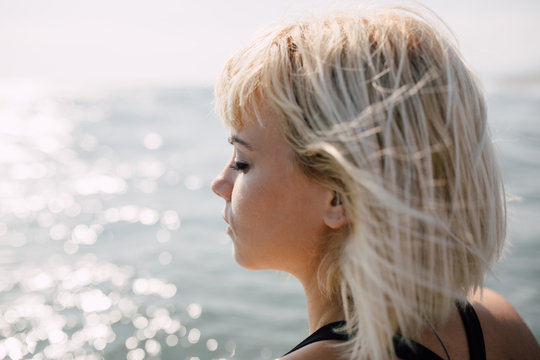 Portrait of a beautiful blonde woman on the beach