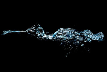 water splash with drops isolated on black background