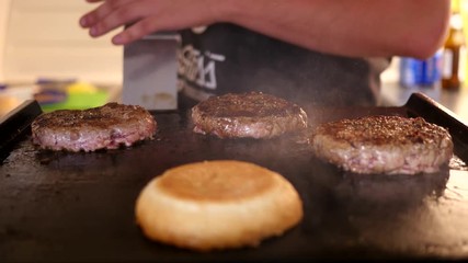 Cooking burger - roast meat cutlet at food fest