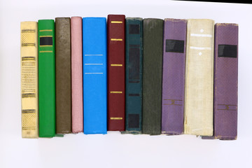 large series old hardcover books, isolated