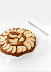 Homemade rustic apple pie on white background