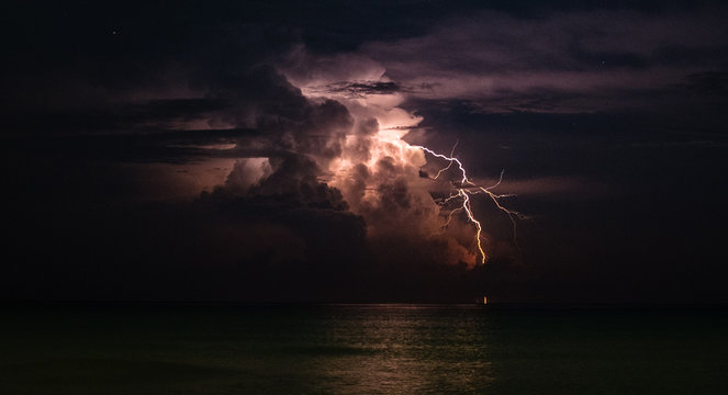 Lighting Strikes the Ocean - Powered by Adobe